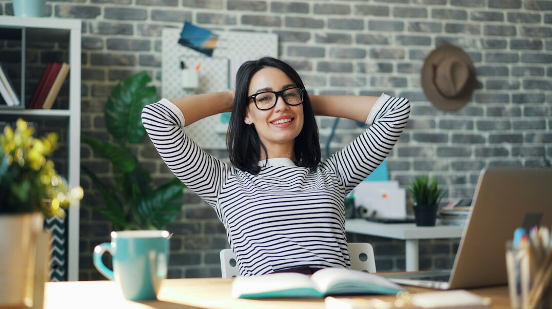 person stretching at desk
