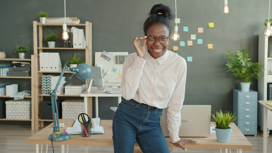 woman leading yoga in office
