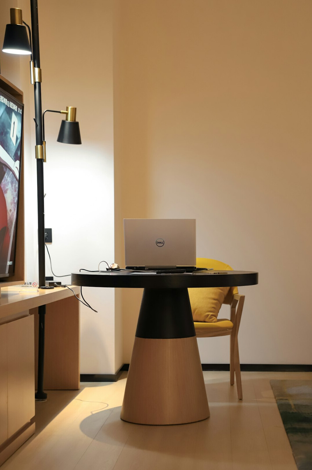 Tidy desk with laptop and notebook in daylight